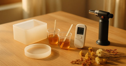 Deep pour epoxy resin moulds and mixing supplies on a wooden craft table in an Indian home studio during summer
