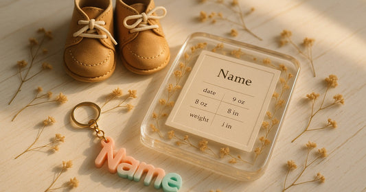 Personalized resin baby keepsake frame and 3D printed name keychain arranged as a first birthday gift for a baby in India