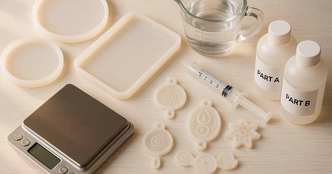 Silicone resin moulds with measuring tools including a digital scale, syringe, and epoxy resin bottles on a craft table