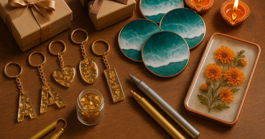 Handmade resin keychains, coasters, and tray with Diwali gifting packaging on a wooden surface