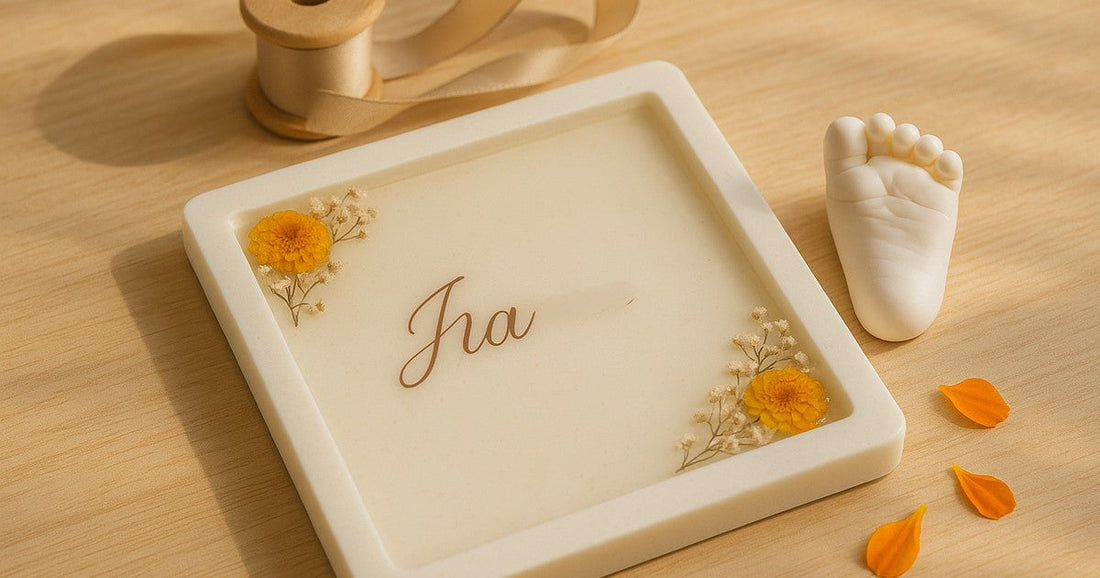 Personalized baby frame gift for newborn with resin details and baby footprint mould on a wooden surface