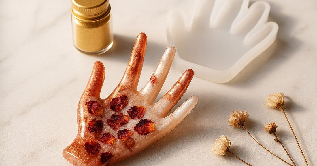 Handmade resin ring holder cast using a silicone ring holder mould with rose gold mica and dried flowers, placed on a marble surface