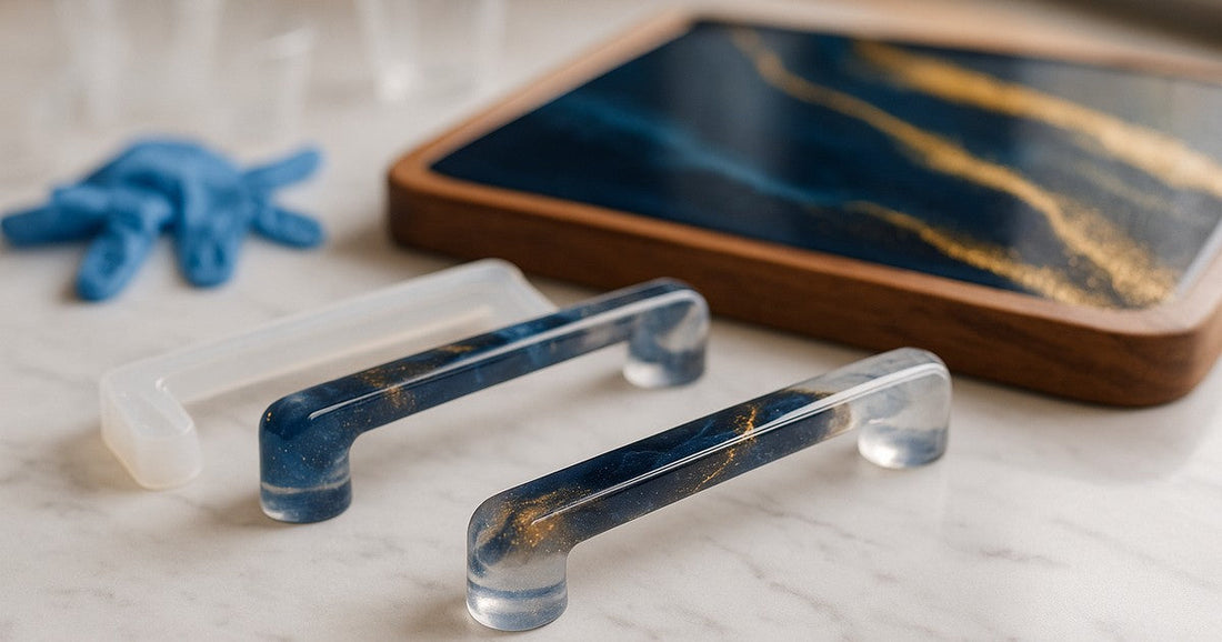Freshly cast epoxy resin tray handles beside a finished resin serving tray on a marble surface in a craft studio