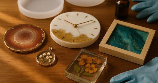 Five different resin products made from one silicone mould set — coaster, pendant, clock, paperweight, and wall art — arranged on a wooden surface
