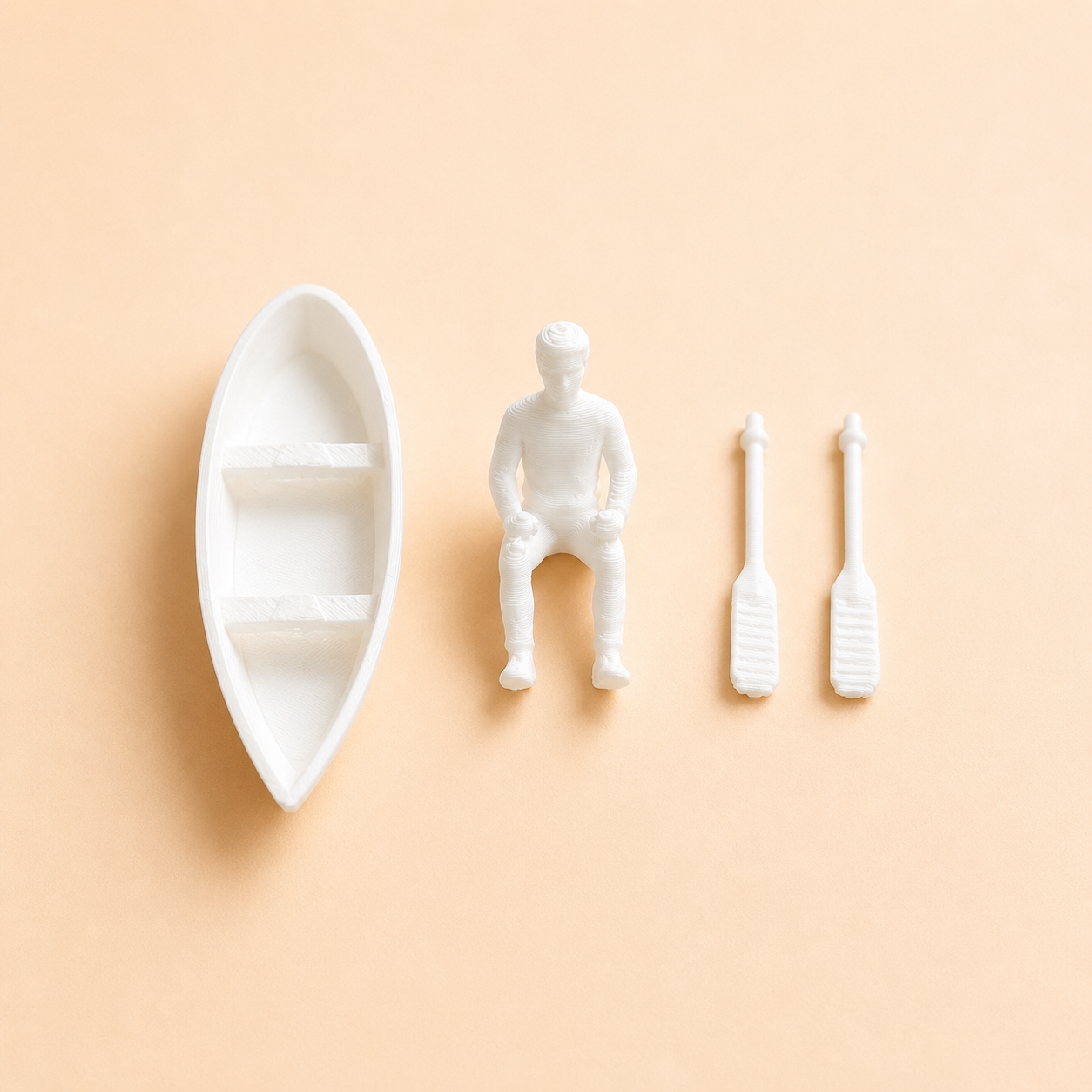 Close-up of miniature boat with man and paddles craft accessory by Shrebhavi