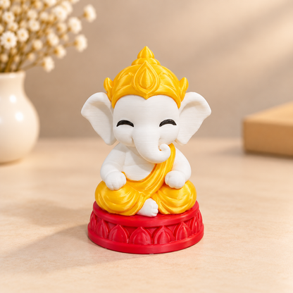 Multicolor Lord Ganesha 3D printed miniature figurine with detailed trunk, crown, and ornate finish, displayed on a white sur