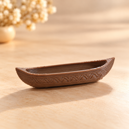 3D printed empty canoe boat miniature placed inside a resin river art tray showing floating effect