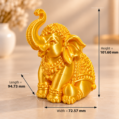 Golden elephant 3D printed miniature in silk gold PLA finish on a white surface, side view showing detailed trunk-up pose