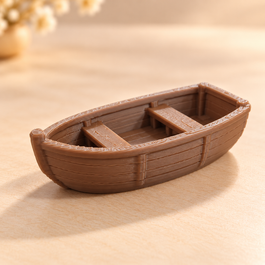 3D printed simple rowboat miniature placed inside epoxy resin ocean art, showing detailed boat silhouette for craft and diora