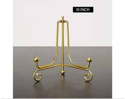 Close-up of gold metal folding stand hinge and finish detail